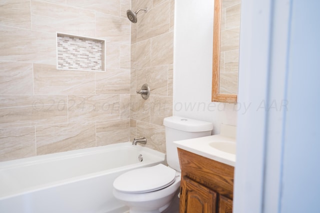 full bathroom featuring vanity, toilet, and tiled shower / bath combo