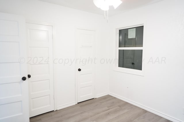 unfurnished bedroom with light hardwood / wood-style floors