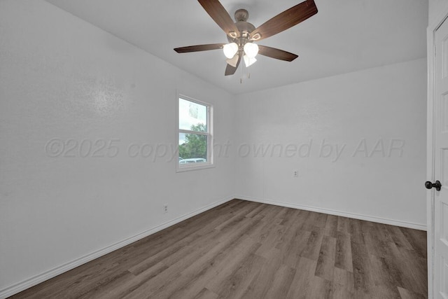 301 Estireno St, Borger, TX 79007 - unfurnished room with ceiling fan, baseboards, and wood finished floors
