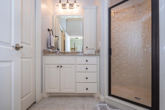 full bathroom with vanity, tile patterned flooring, and a stall shower