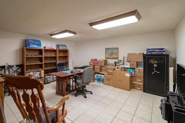 office area featuring a textured ceiling and light tile patterned floors