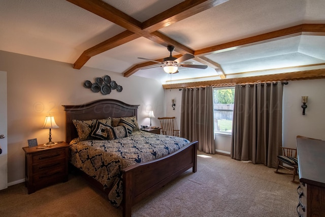 carpeted bedroom featuring beamed ceiling, ceiling fan, and a textured ceiling