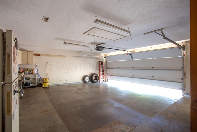 505 Alamo St, Claude, TX 79019 - garage featuring a garage door opener