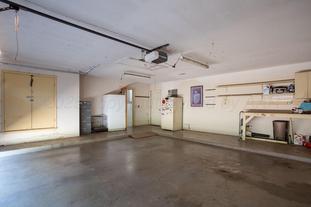505 Alamo St, Claude, TX 79019 - garage with freestanding refrigerator and a garage door opener
