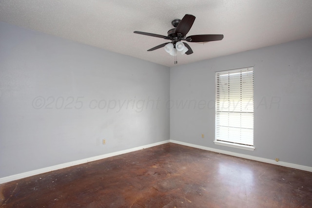 505 Alamo St, Claude, TX 79019 - spare room with concrete flooring, baseboards, and a ceiling fan