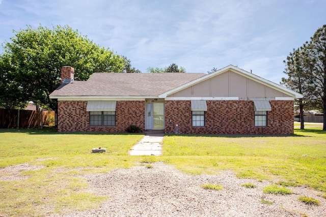 505 Alamo St, Claude, TX 79019 - ranch-style home featuring a chimney, brick siding, and board and batten siding