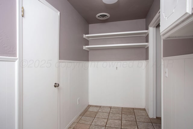 505 Alamo St, Claude, TX 79019 - laundry room with wainscoting