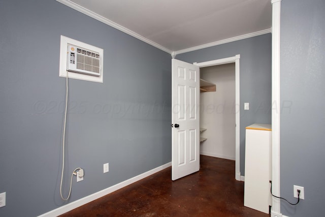 505 Alamo St, Claude, TX 79019 - unfurnished bedroom featuring finished concrete flooring, crown molding, a wall mounted AC, and baseboards