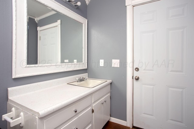 505 Alamo St, Claude, TX 79019 - bathroom with ornamental molding, vanity, and baseboards
