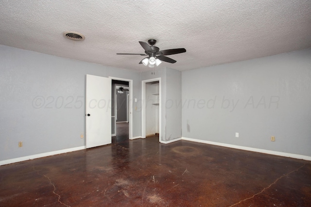 505 Alamo St, Claude, TX 79019 - empty room featuring concrete flooring, ceiling fan, baseboards, and a textured ceiling