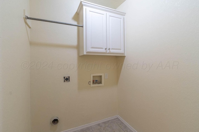 3520 S Mirror St, Amarillo, TX 79118 - washroom with cabinet space, electric dryer hookup, washer hookup, and tile patterned floors