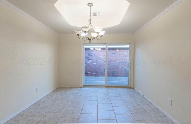 3520 S Mirror St, Amarillo, TX 79118 - spare room featuring a chandelier, a tray ceiling, and ornamental molding