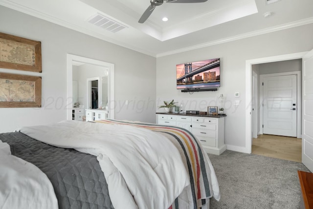 3851 Whitetail Springs Rd, Amarillo, TX 79119 - bedroom featuring visible vents, ornamental molding, a ceiling fan, a tray ceiling, and light carpet