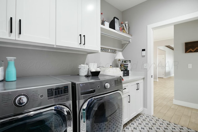 3851 Whitetail Springs Rd, Amarillo, TX 79119 - laundry room with washer and clothes dryer, baseboards, light floors, and cabinet space