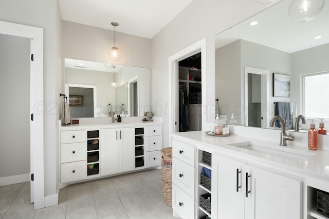3851 Whitetail Springs Rd, Amarillo, TX 79119 - bathroom featuring vanity, a spacious closet, tile patterned flooring, and recessed lighting