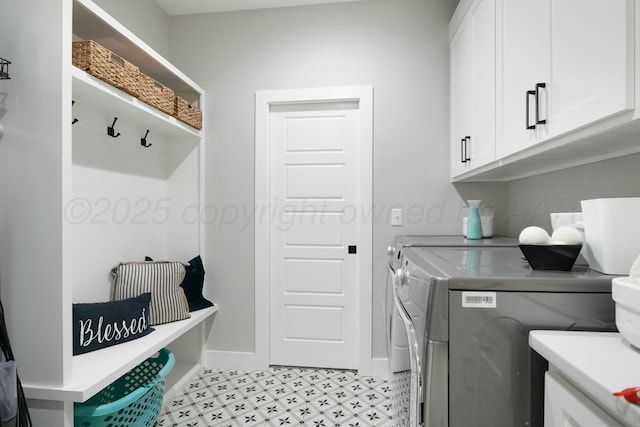 3851 Whitetail Springs Rd, Amarillo, TX 79119 - laundry area featuring cabinet space, baseboards, separate washer and dryer, and light floors