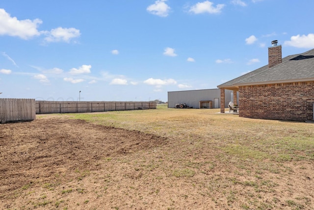 3851 Whitetail Springs Rd, Amarillo, TX 79119 - view of yard with an outbuilding and fence
