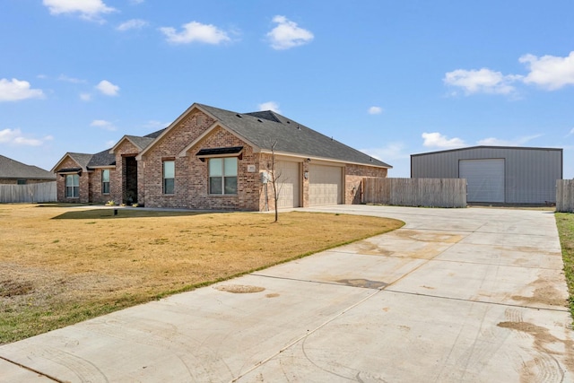 3851 Whitetail Springs Rd, Amarillo, TX 79119 - view of front facade with concrete driveway, a front yard, brick siding, and fence