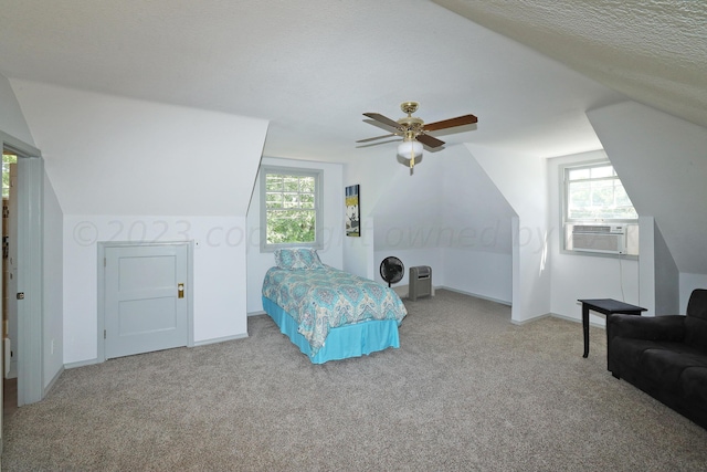 2101 S Harrison St, Amarillo, TX 79109 - bedroom with carpet floors, multiple windows, vaulted ceiling, cooling unit, and baseboards