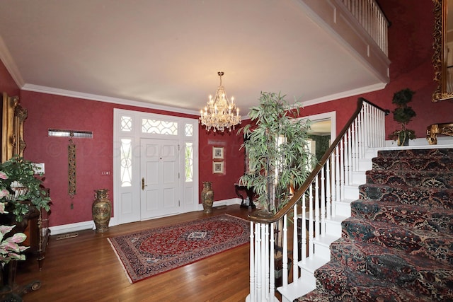 2101 S Harrison St, Amarillo, TX 79109 - entrance foyer featuring wood finished floors, a chandelier, baseboards, crown molding, and stairway