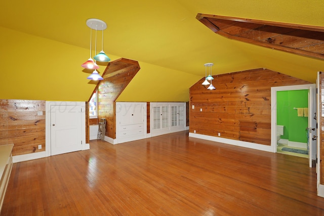 2101 S Harrison St, Amarillo, TX 79109 - additional living space featuring lofted ceiling, wood walls, wood finished floors, and baseboards