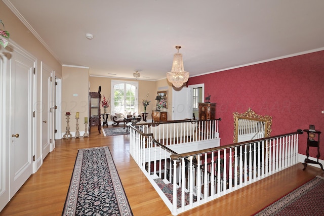 2101 S Harrison St, Amarillo, TX 79109 - corridor featuring light wood finished floors, a chandelier, and crown molding