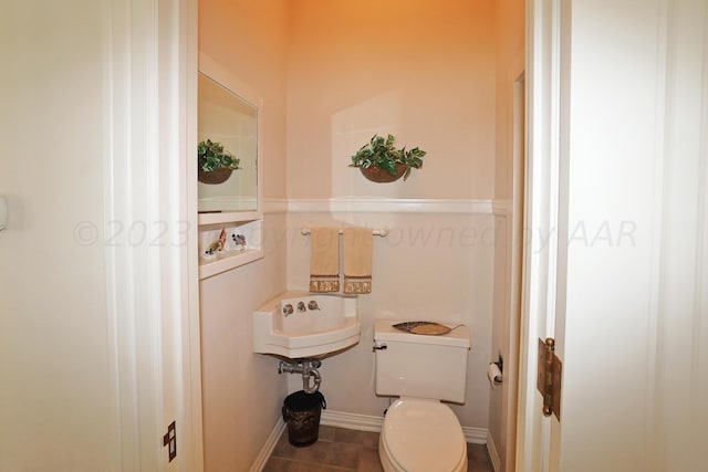 2101 S Harrison St, Amarillo, TX 79109 - bathroom with toilet, tile patterned floors, and a sink