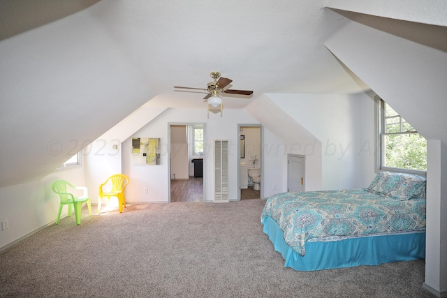 2101 S Harrison St, Amarillo, TX 79109 - carpeted bedroom featuring vaulted ceiling and ensuite bath