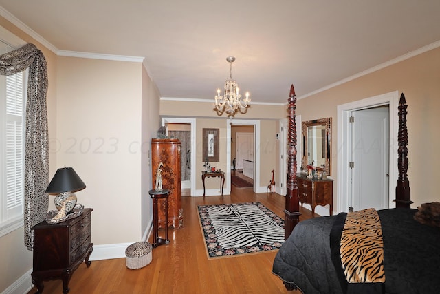 2101 S Harrison St, Amarillo, TX 79109 - bedroom with a chandelier, ornamental molding, wood finished floors, and baseboards