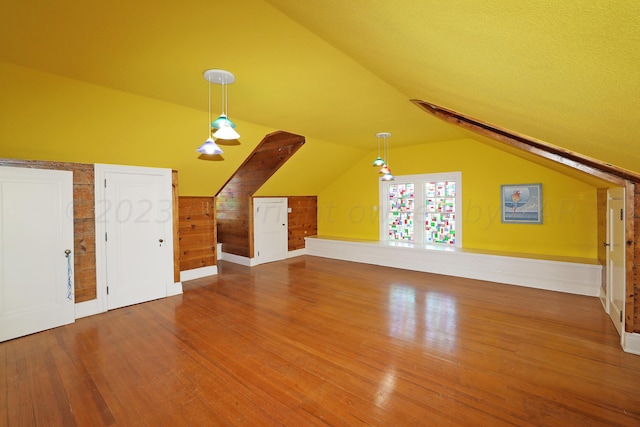 2101 S Harrison St, Amarillo, TX 79109 - bonus room featuring wood finished floors, vaulted ceiling, and baseboards