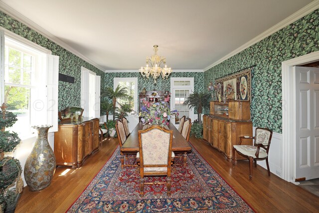 2101 S Harrison St, Amarillo, TX 79109 - dining room featuring wallpapered walls, a chandelier, wood finished floors, and crown molding
