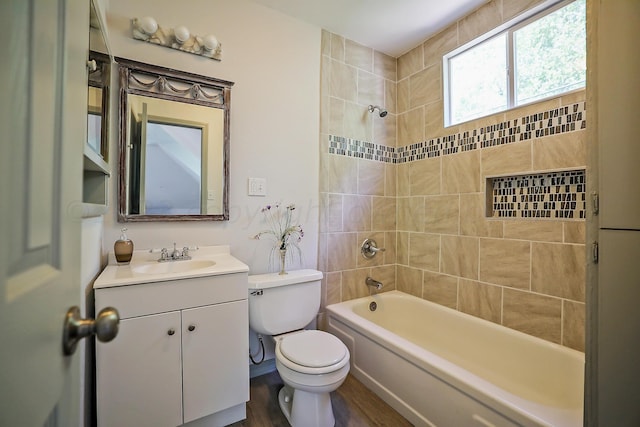 2101 S Harrison St, Amarillo, TX 79109 - bathroom with toilet, vanity, wood finished floors, and tub / shower combination