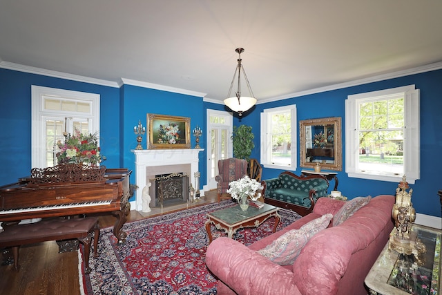 2101 S Harrison St, Amarillo, TX 79109 - living area featuring crown molding, wood finished floors, a fireplace with flush hearth, and baseboards