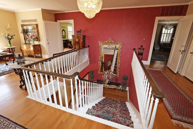 2101 S Harrison St, Amarillo, TX 79109 - stairs with a chandelier, wood finished floors, healthy amount of natural light, and crown molding
