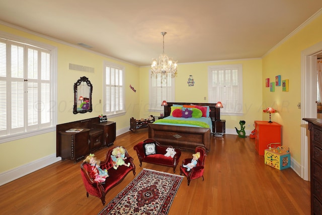 2101 S Harrison St, Amarillo, TX 79109 - bedroom with ornamental molding, wood finished floors, a chandelier, baseboards, and multiple windows