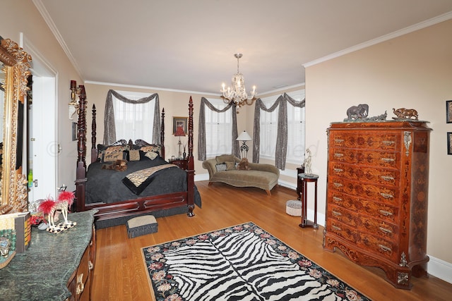 2101 S Harrison St, Amarillo, TX 79109 - bedroom with a chandelier, wood finished floors, ornamental molding, and baseboards