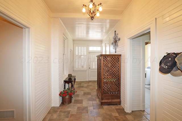 2101 S Harrison St, Amarillo, TX 79109 - hall with stone finish floors and a chandelier