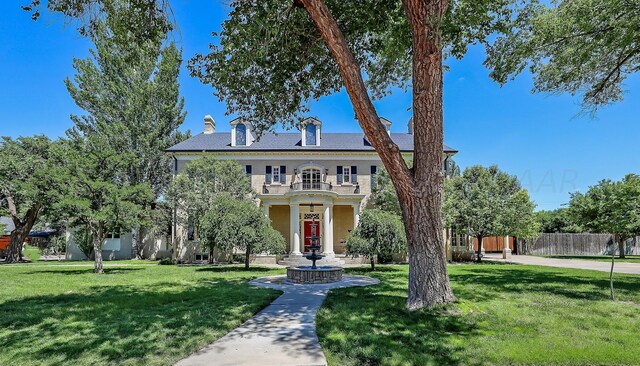 2101 S Harrison St, Amarillo, TX 79109 - georgian-style home with a chimney and a balcony