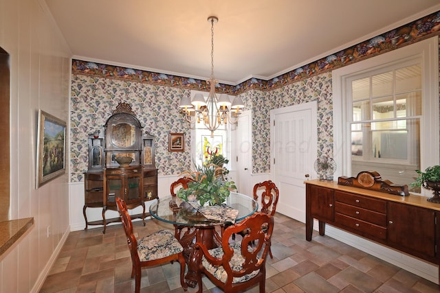 2101 S Harrison St, Amarillo, TX 79109 - dining room with a chandelier, stone finish flooring, crown molding, and wallpapered walls