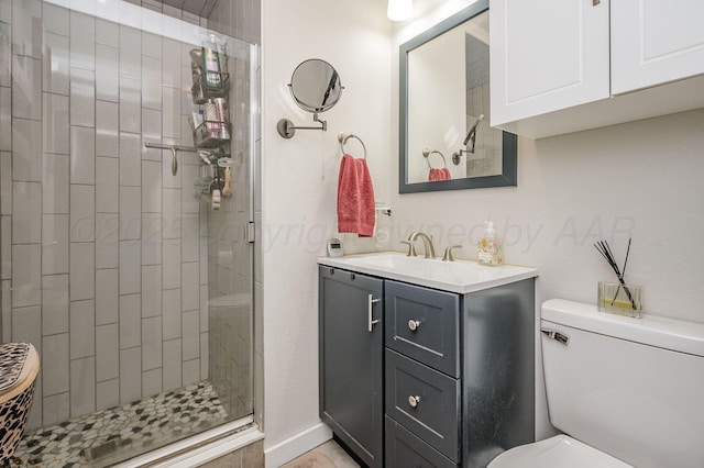 full bathroom featuring vanity, toilet, and a shower stall