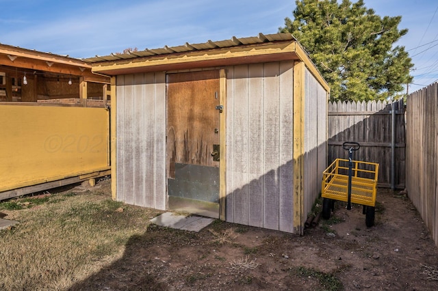 view of shed with a fenced backyard