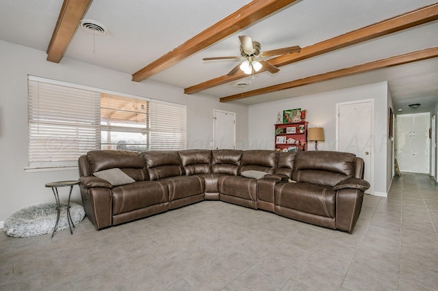 living area with light tile patterned floors, visible vents, beamed ceiling, and ceiling fan