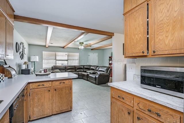 kitchen featuring a ceiling fan, beam ceiling, decorative backsplash, light countertops, and open floor plan