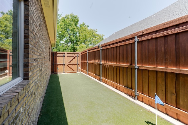 7809 Clearmeadow Dr, Amarillo, TX 79119 - view of yard featuring a gate and a putting green