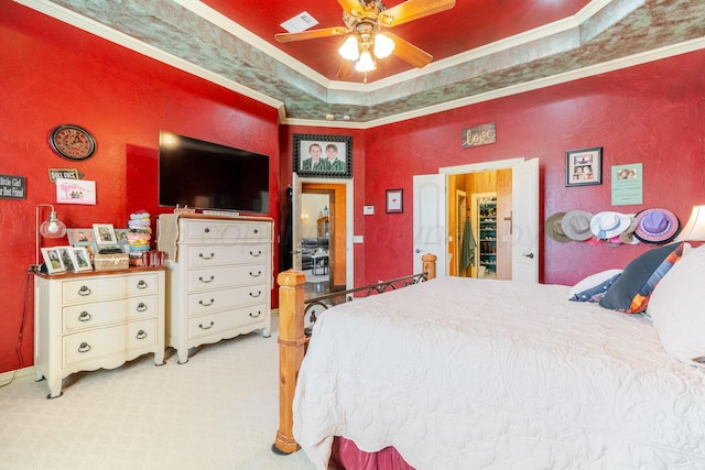 7809 Clearmeadow Dr, Amarillo, TX 79119 - carpeted bedroom with ornamental molding, a textured wall, a ceiling fan, and a tray ceiling