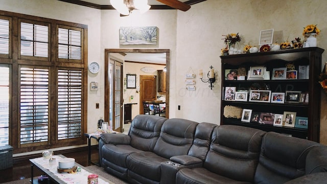 living room featuring hardwood / wood-style floors and crown molding