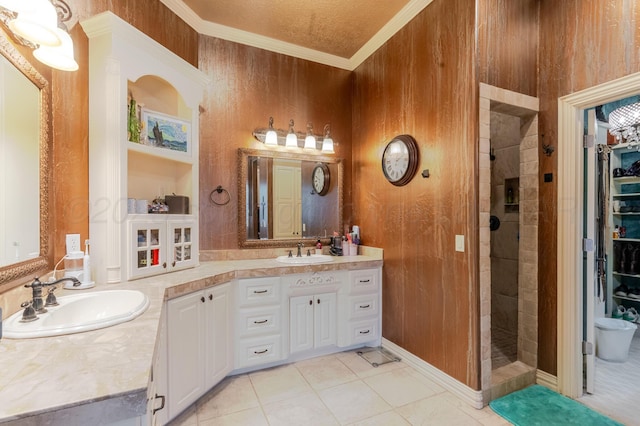 7809 Clearmeadow Dr, Amarillo, TX 79119 - bathroom featuring tiled shower, crown molding, vanity, tile patterned floors, and wooden walls