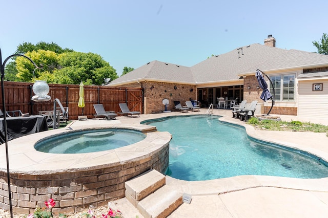 7809 Clearmeadow Dr, Amarillo, TX 79119 - view of swimming pool with a patio, fence, and a pool with connected hot tub