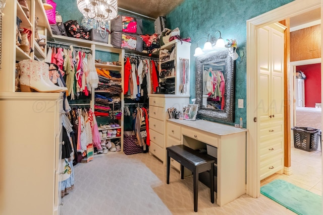 7809 Clearmeadow Dr, Amarillo, TX 79119 - spacious closet with tile patterned flooring, a chandelier, and carpet floors