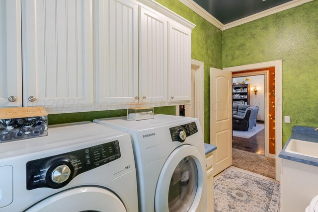 7809 Clearmeadow Dr, Amarillo, TX 79119 - laundry room featuring washing machine and clothes dryer, cabinet space, and ornamental molding